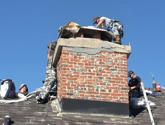East Cleveland Chimney Sweep installing a custom chimney crown in East Cleveland, OH