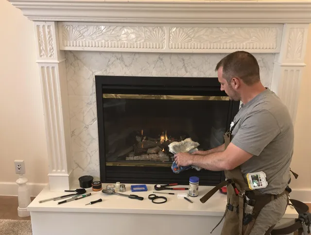 East Cleveland Chimney Sweep performing fireplace maintenance in East Cleveland, OH